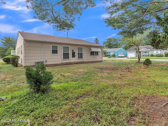 136 Georgetown Rd, Toms River, NJ 08757 - back of property featuring a yard and a detached garage