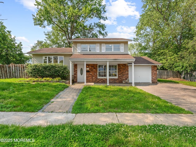 37 Bryant Dr, Jackson, NJ 08527 - tri-level home featuring asphalt driveway, an attached garage, and covered porch