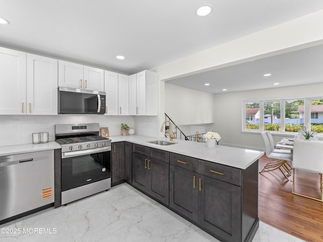 37 Bryant Dr, Jackson, NJ 08527 - kitchen featuring appliances with stainless steel finishes, a peninsula, white cabinets, light countertops, and recessed lighting