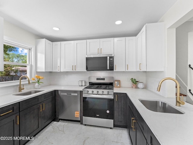37 Bryant Dr, Jackson, NJ 08527 - kitchen with appliances with stainless steel finishes, white cabinets, light marble finish floors, backsplash, and recessed lighting