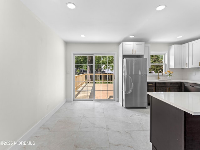 37 Bryant Dr, Jackson, NJ 08527 - kitchen featuring appliances with stainless steel finishes, light countertops, recessed lighting, light marble finish flooring, and healthy amount of natural light
