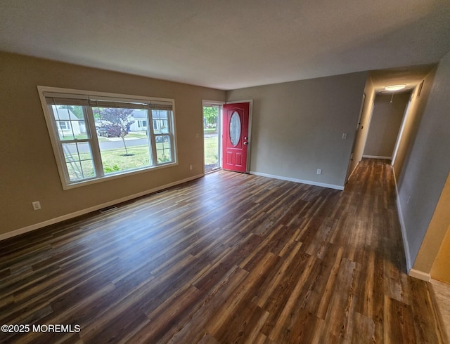1236 Bewick St, Toms River, NJ 08753 - unfurnished living room with dark wood-type flooring and baseboards