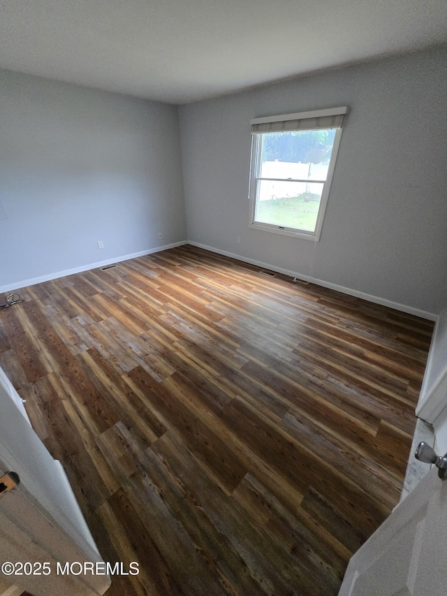 1236 Bewick St, Toms River, NJ 08753 - spare room featuring dark wood-type flooring and baseboards