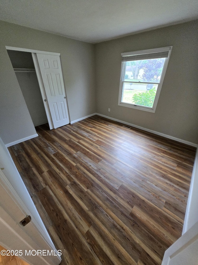 1236 Bewick St, Toms River, NJ 08753 - unfurnished bedroom featuring dark wood finished floors and a closet
