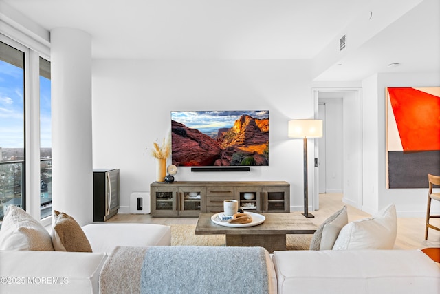 1101 Ocean Ave Unit 1404, Asbury Park, NJ 07712 - living area with baseboards and light wood-style floors