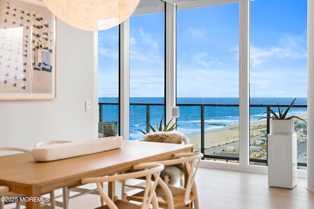 1101 Ocean Ave Unit 1404, Asbury Park, NJ 07712 - dining room featuring wood finished floors, view of water and beach, and expansive windows