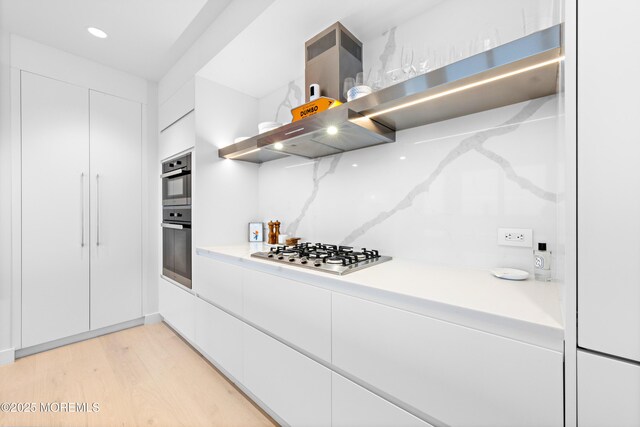 1101 Ocean Ave Unit 1404, Asbury Park, NJ 07712 - kitchen with appliances with stainless steel finishes, white cabinets, light wood-style floors, open shelves, and recessed lighting