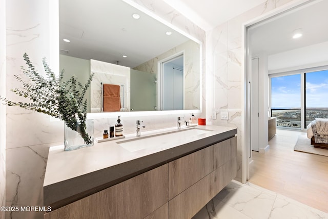 1101 Ocean Ave Unit 1404, Asbury Park, NJ 07712 - bathroom with vanity, marble finish flooring, recessed lighting, and a marble finish shower