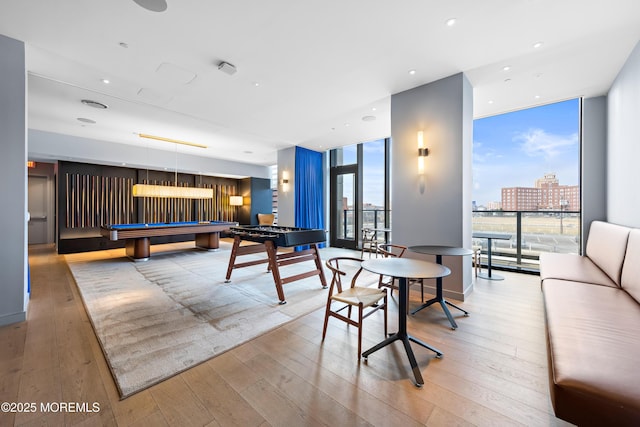 1101 Ocean Ave Unit 1404, Asbury Park, NJ 07712 - playroom featuring floor to ceiling windows, pool table, and hardwood / wood-style floors