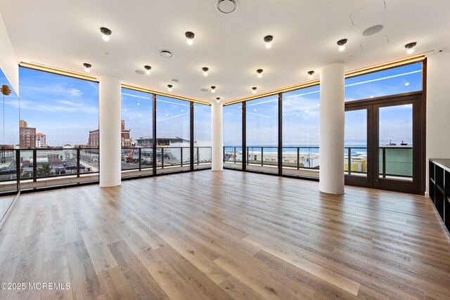 1101 Ocean Ave Unit 1404, Asbury Park, NJ 07712 - unfurnished room featuring wood finished floors and a water view