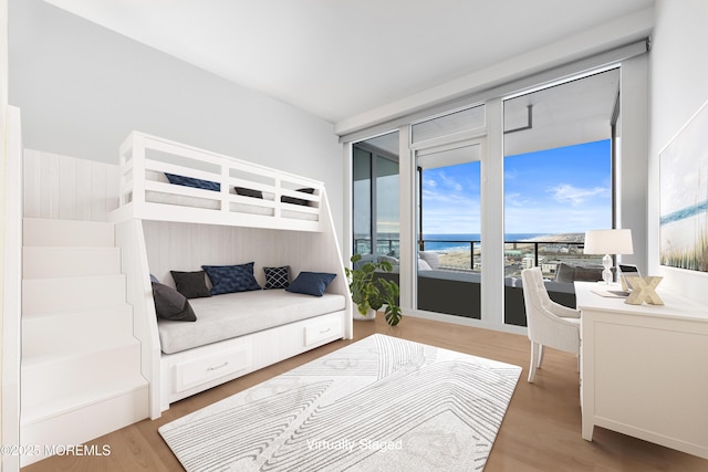 1101 Ocean Ave Unit 1404, Asbury Park, NJ 07712 - bedroom featuring light wood-type flooring, access to outside, and a water view