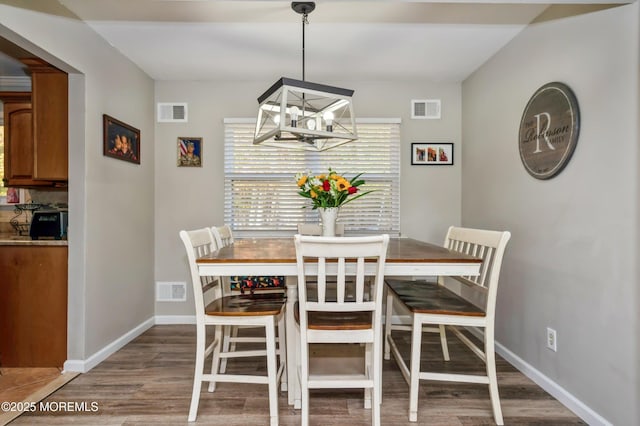 128 Oak Glen Rd, Toms River, NJ 08753 - dining room with a chandelier and wood finished floors
