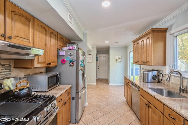 128 Oak Glen Rd, Toms River, NJ 08753 - kitchen with under cabinet range hood, appliances with stainless steel finishes, crown molding, decorative backsplash, and light stone counters