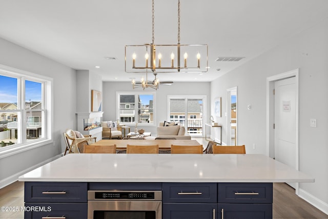 56 Gregg Dr, Beach Haven West, NJ 08050 - kitchen with a chandelier, dark wood-style flooring, plenty of natural light, light countertops, and recessed lighting