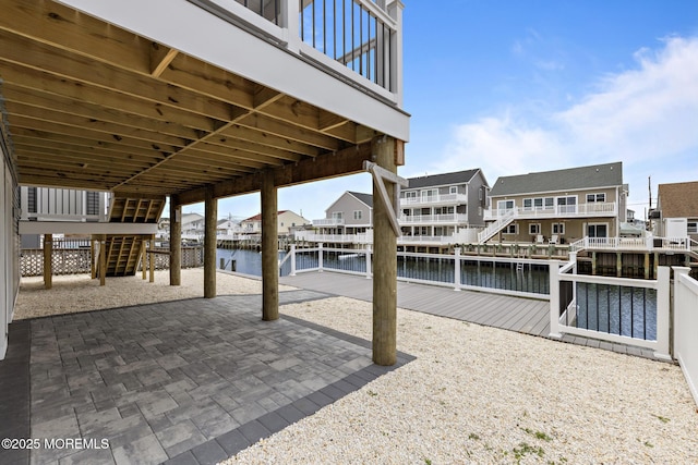 56 Gregg Dr, Beach Haven West, NJ 08050 - view of patio featuring stairway, a water view, a dock, and a residential view