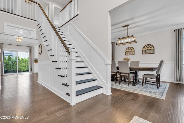 798A Warren St Unit A, Toms River, NJ 08753 - staircase featuring wood finished floors, a chandelier, ornamental molding, and a towering ceiling