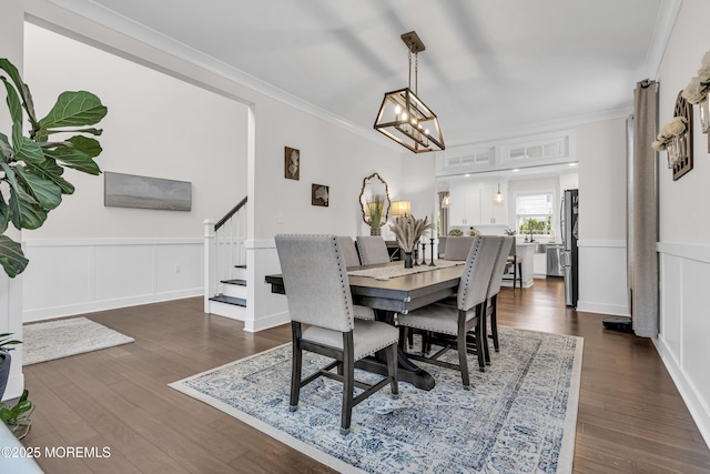798A Warren St Unit A, Toms River, NJ 08753 - dining room featuring stairs, dark wood-style flooring, crown molding, a wainscoted wall, and a chandelier