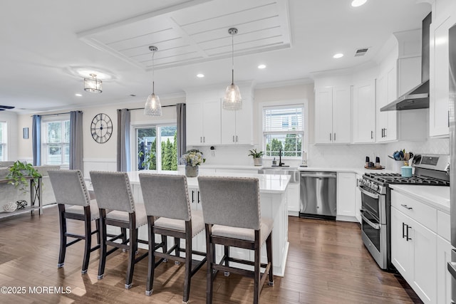 798A Warren St Unit A, Toms River, NJ 08753 - kitchen with stainless steel appliances, plenty of natural light, a kitchen breakfast bar, light countertops, and ornamental molding