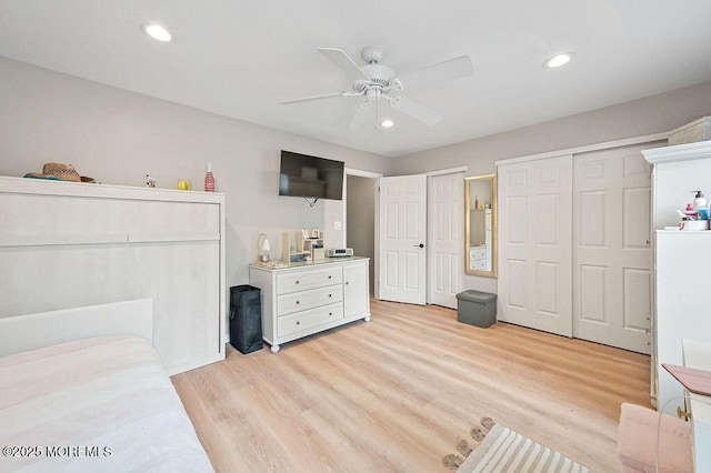 49 Scarborough Ct Unit 3, Freehold, NJ 07728 - bedroom with multiple closets, light wood-style flooring, recessed lighting, and a ceiling fan