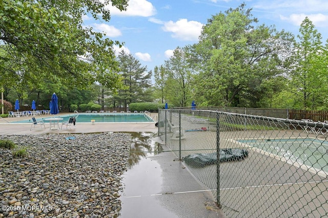 49 Scarborough Ct Unit 3, Freehold, NJ 07728 - community pool featuring view of scattered trees and a patio