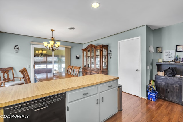 8 Tijuana Ct, Toms River, NJ 08757 - kitchen with dishwasher, a chandelier, dark wood finished floors, decorative light fixtures, and white cabinetry