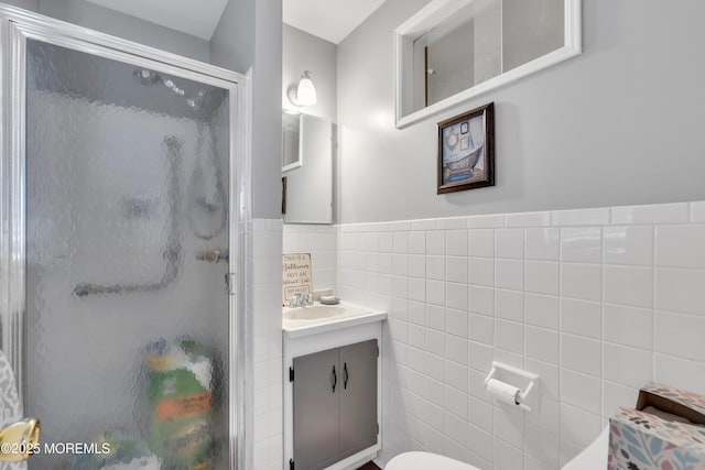 8 Tijuana Ct, Toms River, NJ 08757 - full bathroom with tile walls, a stall shower, vanity, and a wainscoted wall