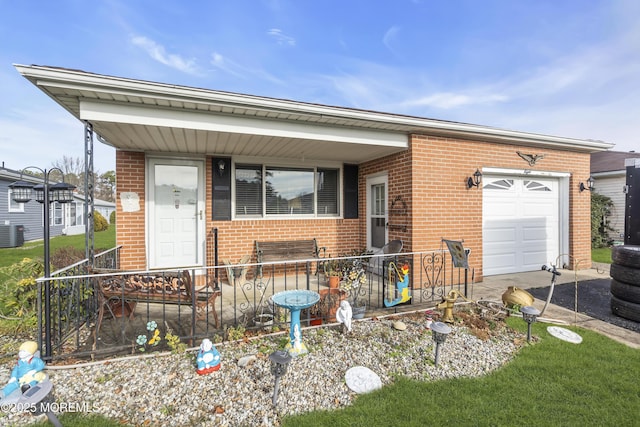 8 Tijuana Ct, Toms River, NJ 08757 - view of front of property with brick siding, a garage, a porch, and driveway