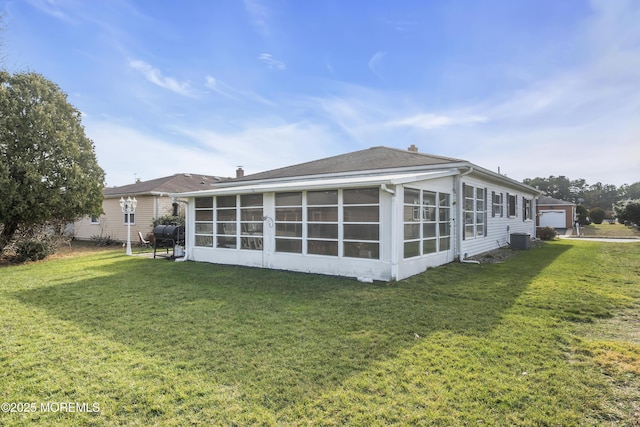 8 Tijuana Ct, Toms River, NJ 08757 - back of property featuring a sunroom, a yard, and a garage