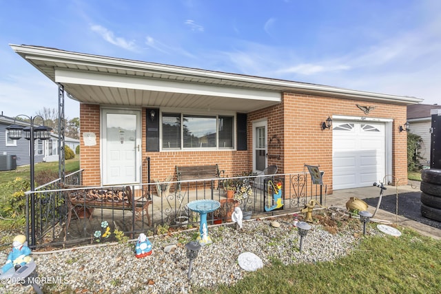 8 Tijuana Ct, Toms River, NJ 08757 - view of front of property with brick siding, an attached garage, and a porch