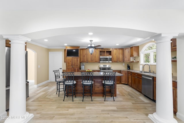 1792 Todd Rd, Toms River, NJ 08755 - kitchen featuring appliances with stainless steel finishes, arched walkways, open shelves, ornate columns, and recessed lighting