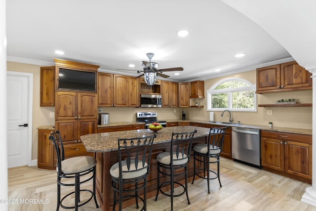 1792 Todd Rd, Toms River, NJ 08755 - kitchen featuring appliances with stainless steel finishes, open shelves, recessed lighting, stone counters, and a breakfast bar
