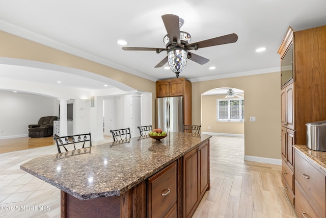 1792 Todd Rd, Toms River, NJ 08755 - kitchen with freestanding refrigerator, arched walkways, a ceiling fan, ornate columns, and open floor plan