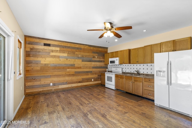 1792 Todd Rd, Toms River, NJ 08755 - kitchen with white appliances, ceiling fan, brown cabinetry, dark wood-type flooring, and wood walls