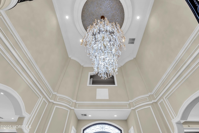 5 Champlain Ct, Lakewood, NJ 08701 - detailed view of a decorative wall, a chandelier, ornamental molding, recessed lighting, and arched walkways