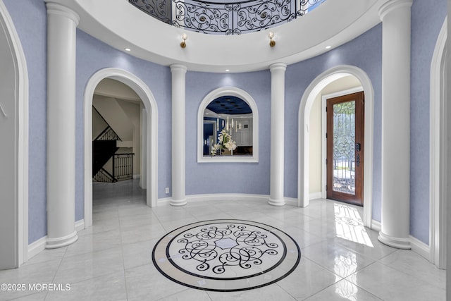 5 Champlain Ct, Lakewood, NJ 08701 - entrance foyer with inlaid floor details, a towering ceiling, and arched walkways