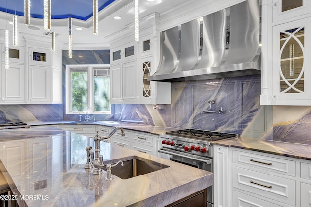 5 Champlain Ct, Lakewood, NJ 08701 - kitchen with wall chimney range hood, premium stove, tasteful backsplash, white cabinets, and crown molding
