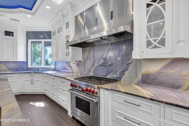 5 Champlain Ct, Lakewood, NJ 08701 - kitchen with designer range, wall chimney range hood, white cabinets, backsplash, and crown molding