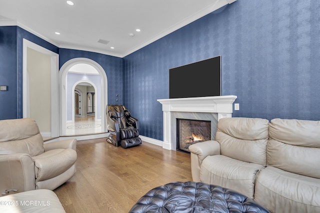 5 Champlain Ct, Lakewood, NJ 08701 - living room with wood finished floors, ornamental molding, arched walkways, a premium fireplace, and recessed lighting