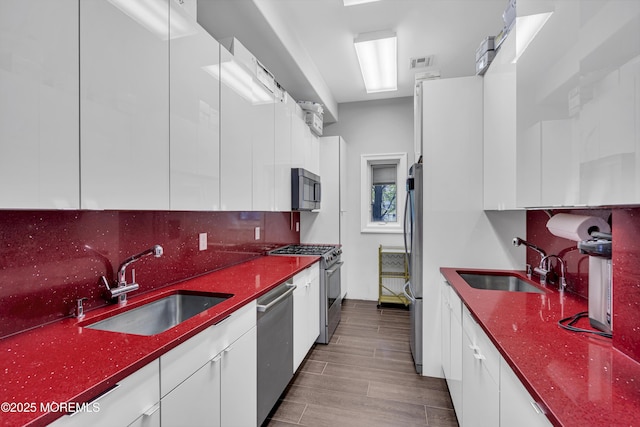 5 Champlain Ct, Lakewood, NJ 08701 - kitchen with stainless steel appliances, modern cabinets, and white cabinetry