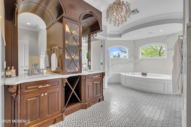 5 Champlain Ct, Lakewood, NJ 08701 - bathroom featuring vanity, a garden tub, and ornamental molding