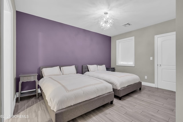 5 Champlain Ct, Lakewood, NJ 08701 - bedroom featuring a chandelier and light wood-style floors