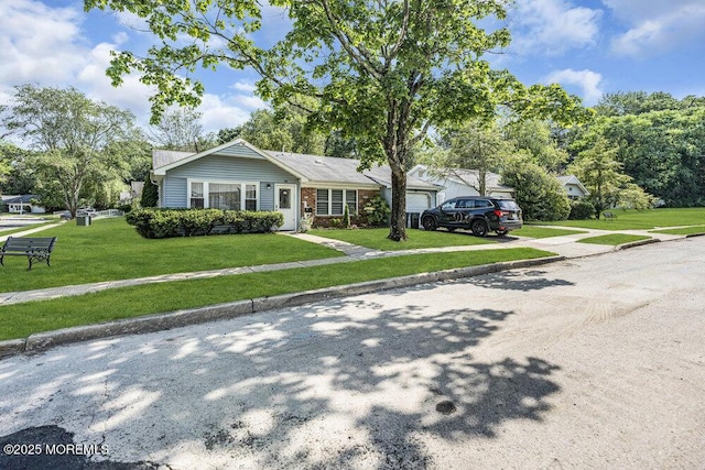 58 Hedge Dr, Lakewood, NJ 08701 - view of front facade with an attached garage, a front yard, and driveway