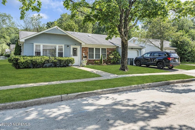 58 Hedge Dr, Lakewood, NJ 08701 - view of front of property featuring a front lawn, brick siding, concrete driveway, and a garage