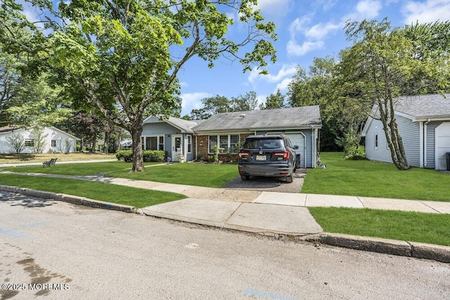 58 Hedge Dr, Lakewood, NJ 08701 - single story home with a front lawn, driveway, a garage, and brick siding