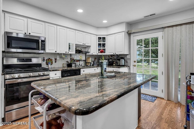 58 Hedge Dr, Lakewood, NJ 08701 - kitchen with stainless steel appliances, white cabinetry, decorative backsplash, light wood-type flooring, and recessed lighting
