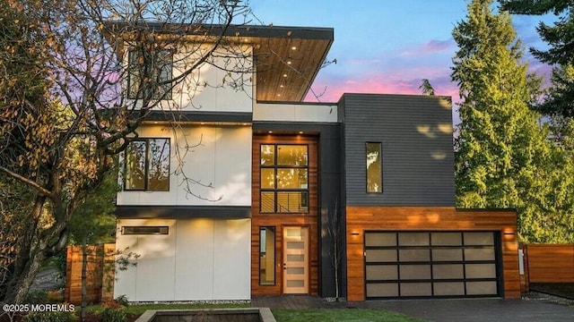 23 Royal Dr, Brick, NJ 08723 - modern home featuring an attached garage, stucco siding, and driveway