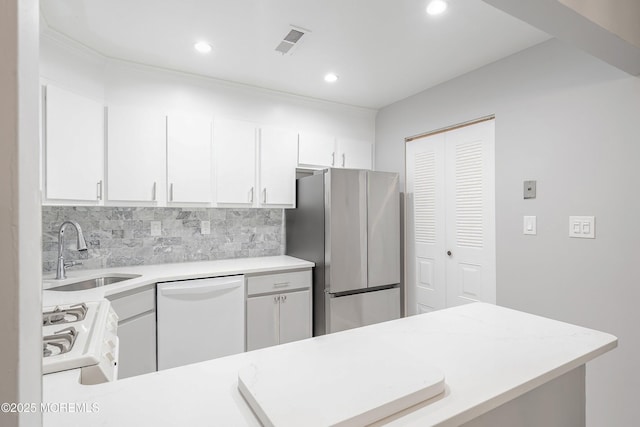 33 Honeysuckle Ln Unit 194, Red Bank, NJ 07701 - kitchen with white appliances, light countertops, backsplash, white cabinetry, and recessed lighting