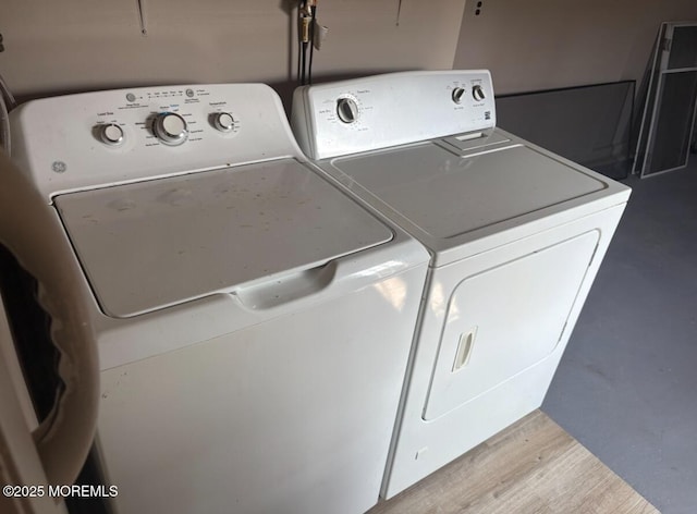 101 Bonaire Dr, Toms River, NJ 08757 - washroom with washing machine and dryer and wood finished floors