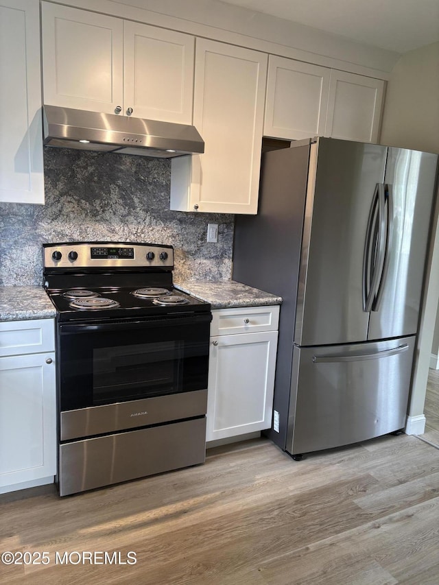 101 Bonaire Dr, Toms River, NJ 08757 - kitchen featuring stainless steel appliances, under cabinet range hood, tasteful backsplash, and white cabinetry