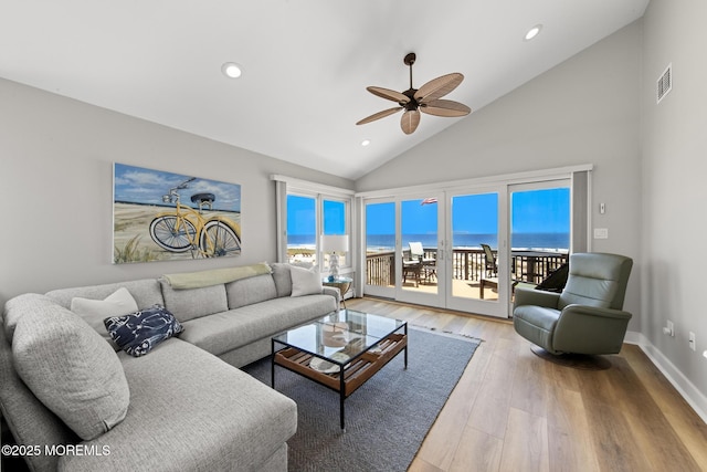 208 E 20th St, Long Beach Twp, NJ 08008 - living room with a ceiling fan, recessed lighting, high vaulted ceiling, wood finished floors, and a water view